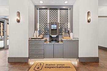 A reception area with a sign that says raise your expectations